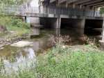 stream under and below bridge no gravel bar